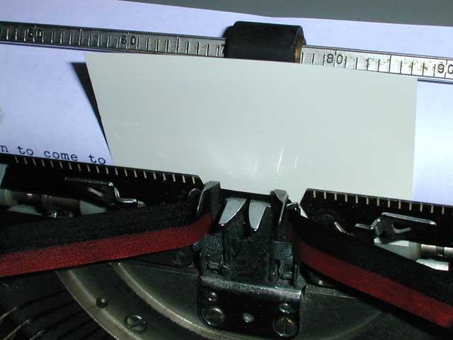 Correction film in a typewriter: retype the wrong letter to press white over it.
